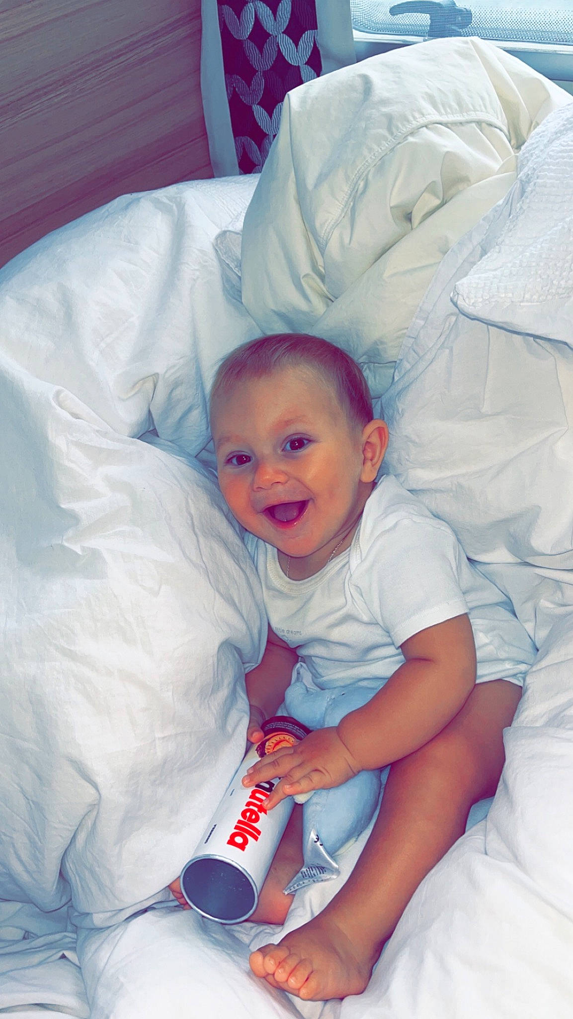 Ismaël a rejoint le concours — aidez-le/la à gagner de superbes lots ! arm, baby, baby_products, baby_toddler_clothing, carmine, child, comfort, event, eye, fun, happy, human, joy, linens, person, product, room, sitting, smile, textile