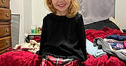 Ava is registered to the contest to win money with this photo: bed, bedroom, blanket, blonde, blouse, bodypart, cabinet, child, closet, clothing, couch, cupboard, dormroom, drawer, dress, dressingroom, face, female, finger, furniture