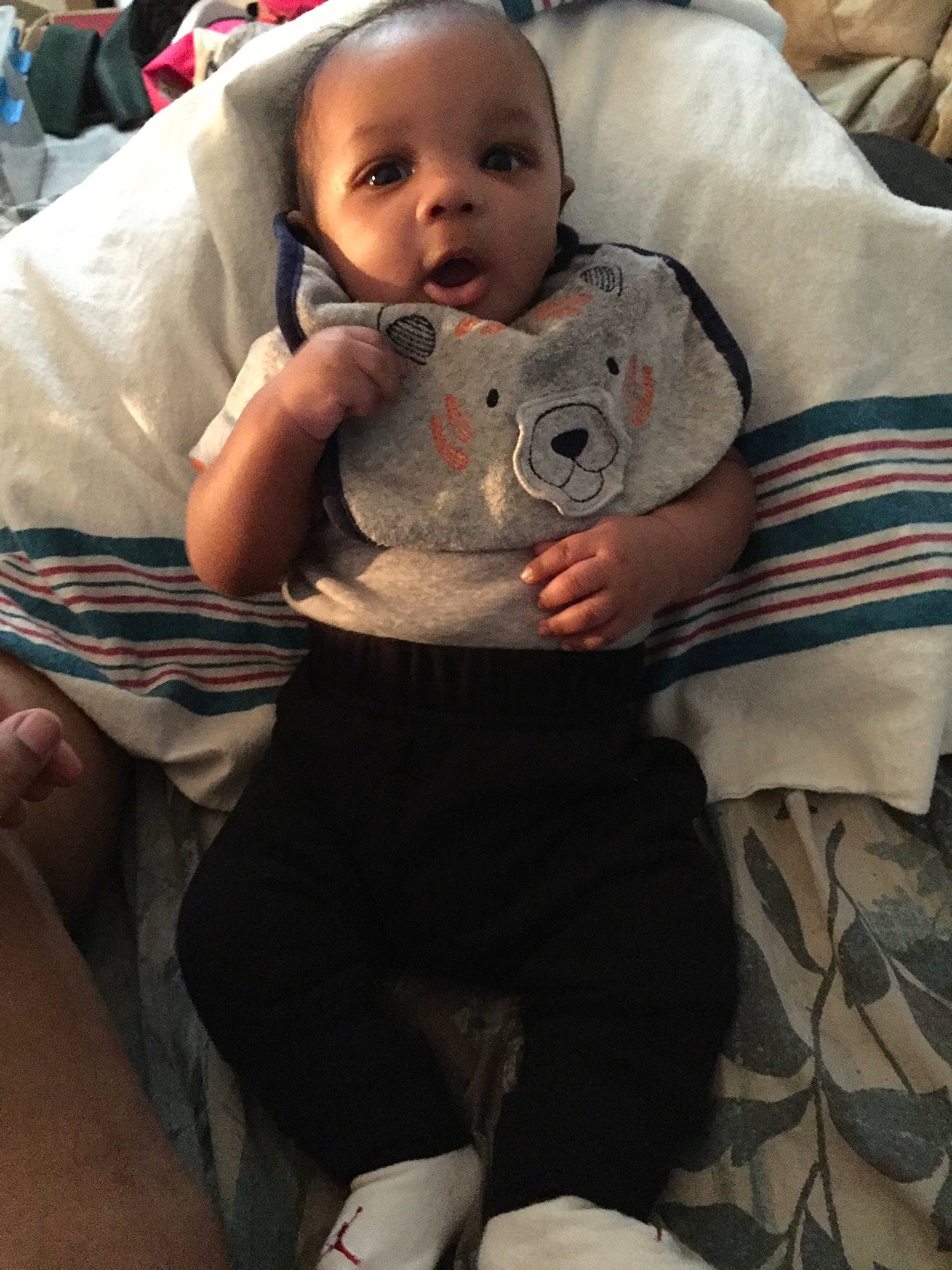 Kamal is registered to the contest to win money with this photo: baby, child, linens, person, skin, toddler