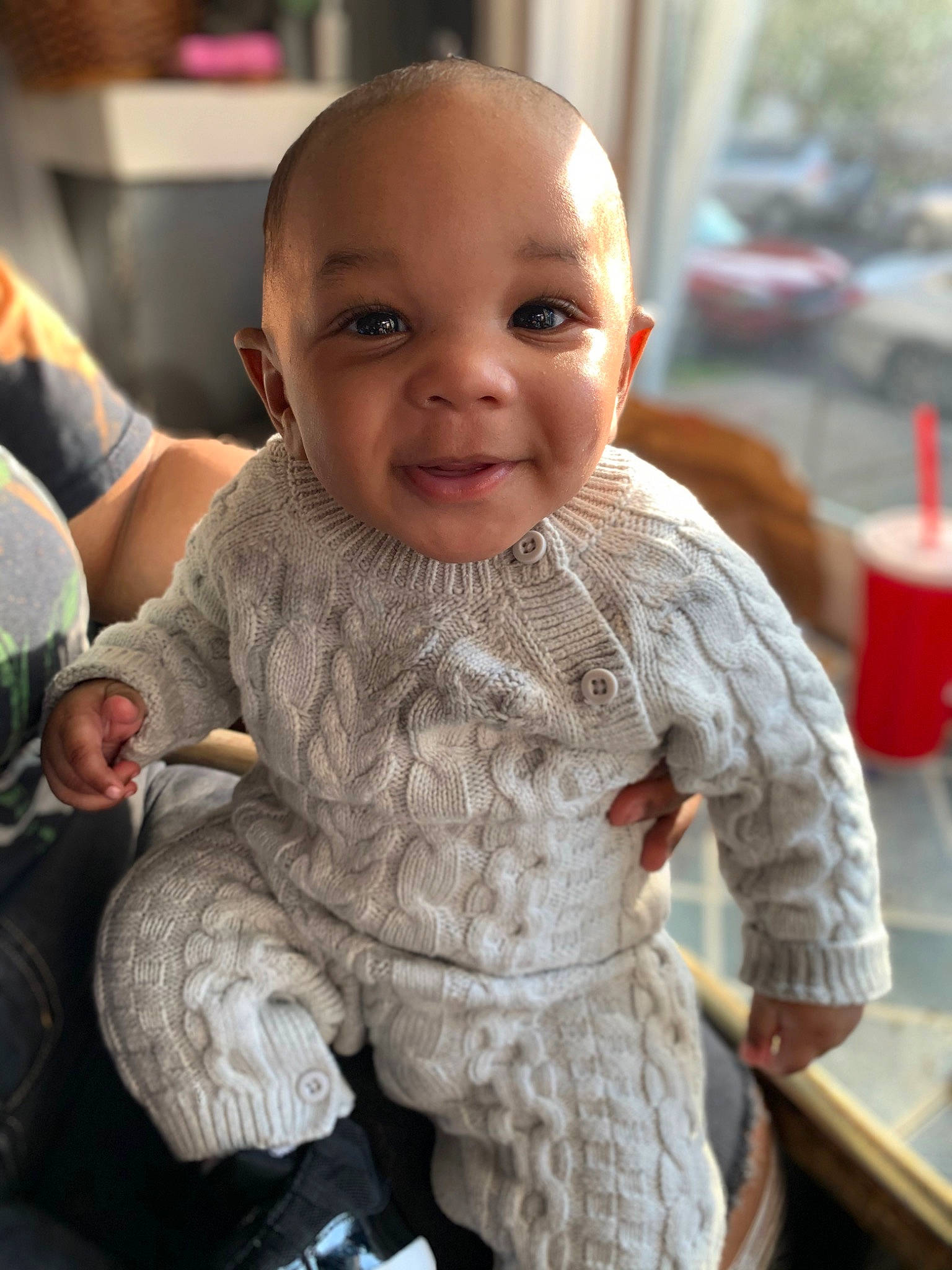 Kamal is registered to the contest to win money with this photo: baby, cheek, child, face, head, joy, person, sitting, skin, smile, toddler