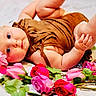 Mckenna joined the competition — help win amazing prizes! baby, blue_eyes, brown_outfit, child, chubby, cute, flower, flower_headband, foot, hand, head, infant, lying_down, pink_flower, pink_roses, portrait, red_roses, roses, skin, white_background