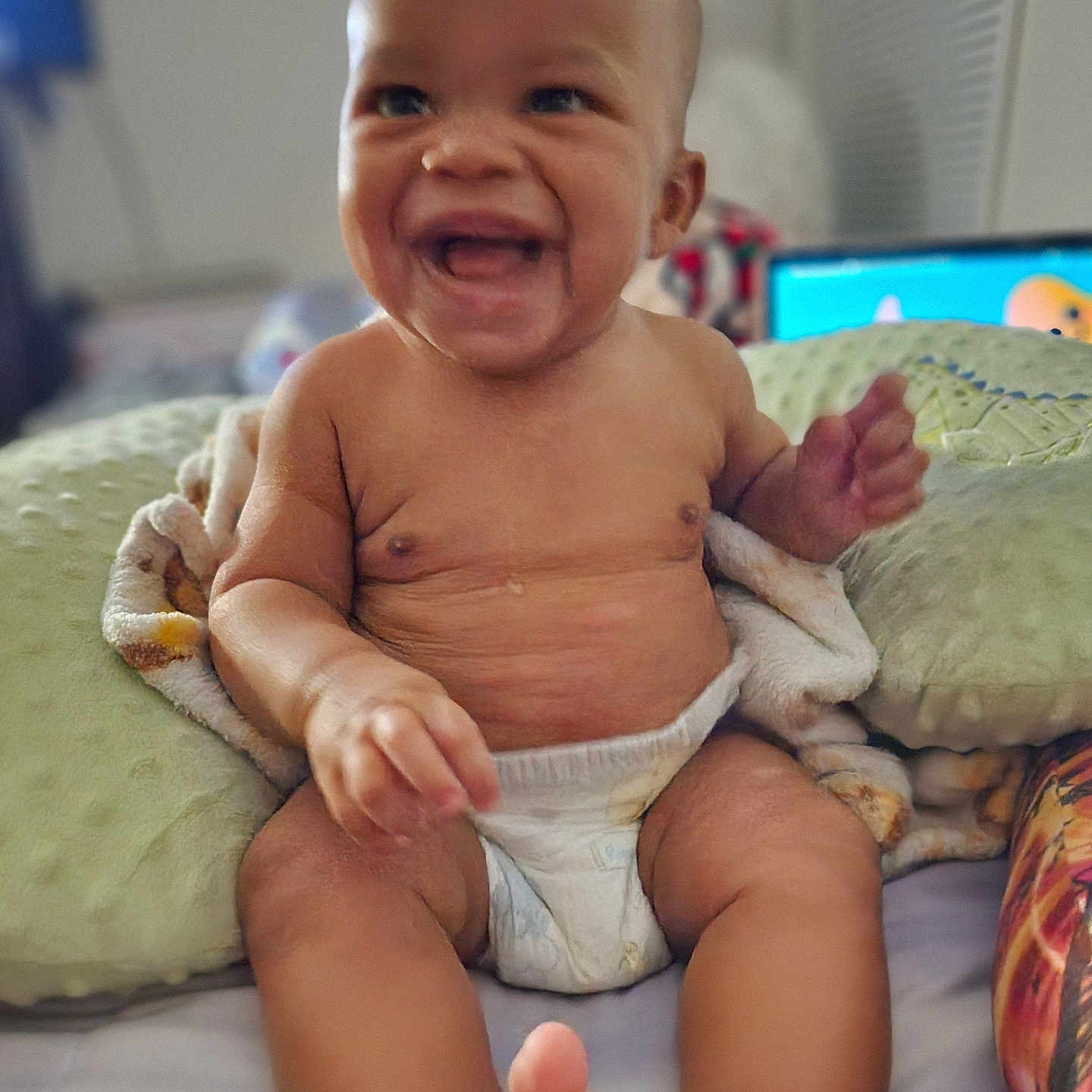 Ki'Mahri-Oryx joined the competition — help win amazing prizes! baby, babylaughing, bodypart, computerhardware, couch, diaper, electronics, face, finger, furniture, hand, happy, hardware, head, monitor, person, photography, portrait, screen, sitting