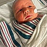 newborn, baby, hospital, blanket, medical_patch, infant, face, swaddled, bed, patient, healthcare, toddler, cute, sleeping, closeup, person, skin, newborn_baby, hospital_bed, resting