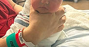 Oliver joined the competition — help win amazing prizes! baby, newborn, hospital, blanket, hand, wristband, person, infant, bed, medical, patient, hospital_room, wrapped, child, skin, face, cute, hospital_bed, tattoo, allergy