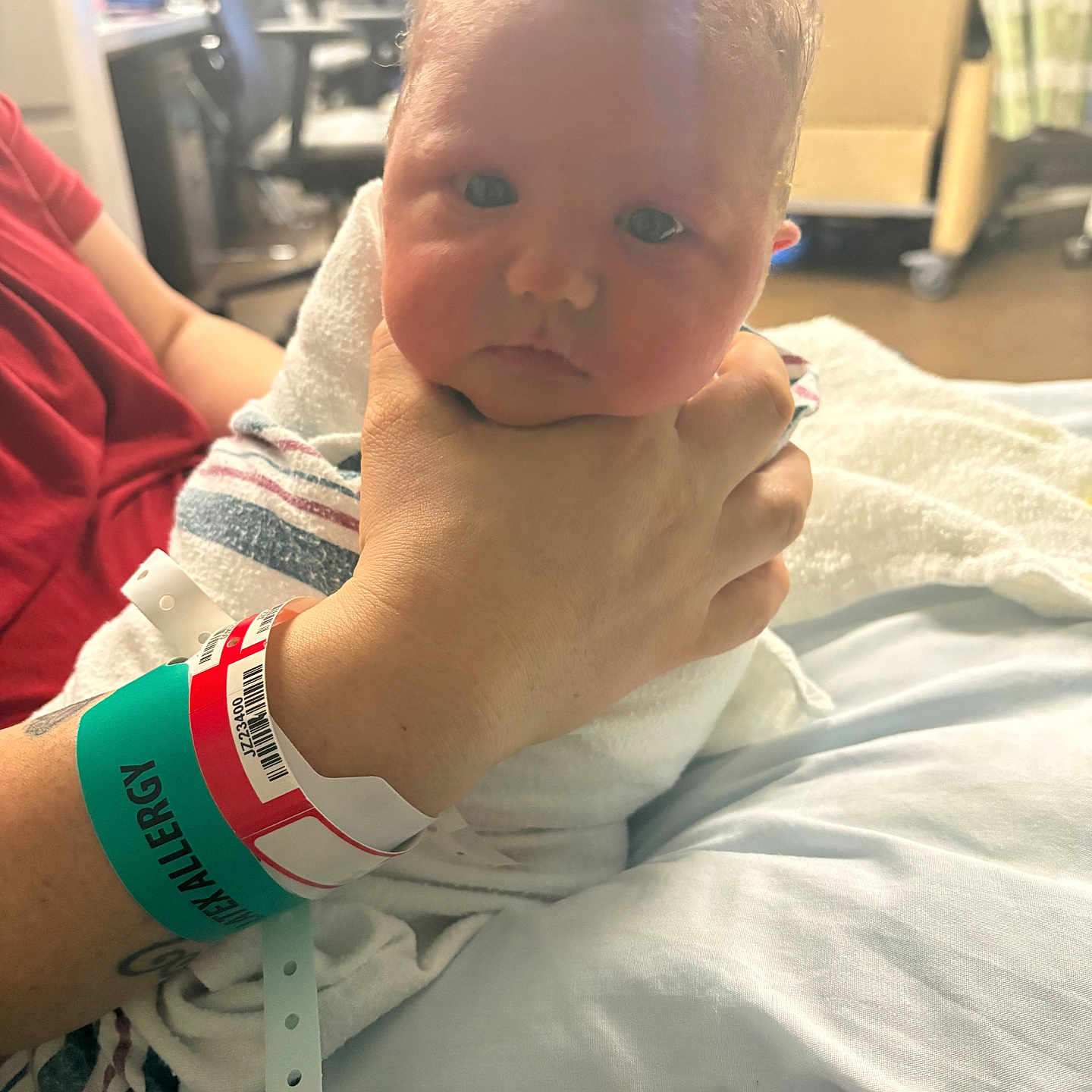 Oliver joined the competition — help win amazing prizes! baby, newborn, hospital, blanket, hand, wristband, person, infant, bed, medical, patient, hospital_room, wrapped, child, skin, face, cute, hospital_bed, tattoo, allergy