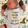 Oliver joined the competition — help win amazing prizes! baby, newborn, infant, mittens, onesie, text, blanket, animal_pattern, giraffe, koala, leaf_pattern, child, sleeping, cute, lying_down, colorful, soft, clothing, peaceful, portrait