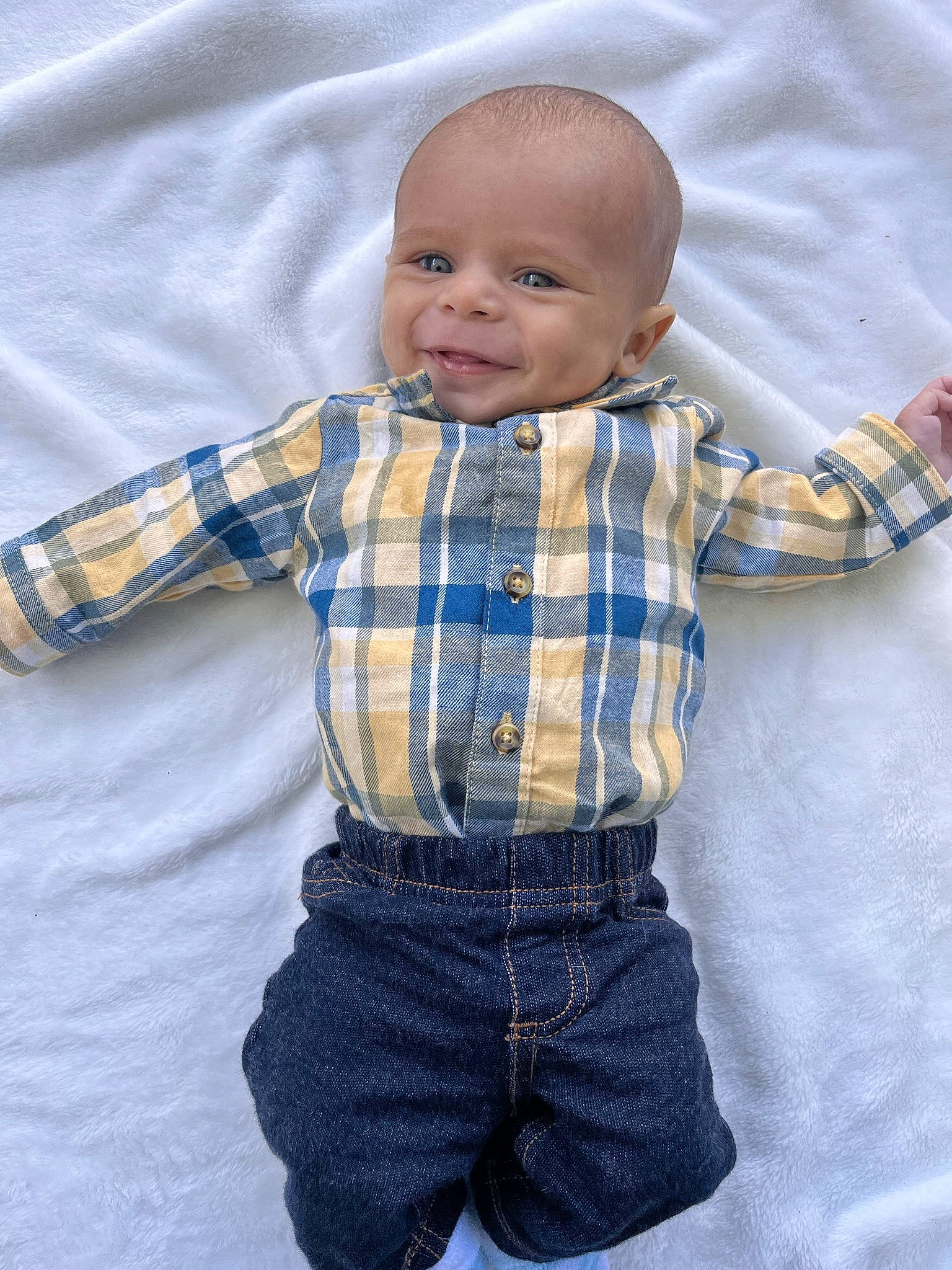 Memphis is registered to the contest to win money with this photo: baby, baby_toddler_clothing, child, clothing, collar, denim, dress_shirt, electric_blue, face, jeans, outerwear, pattern, person, plaid, product, skin, sleeve, smile, tartan, textile