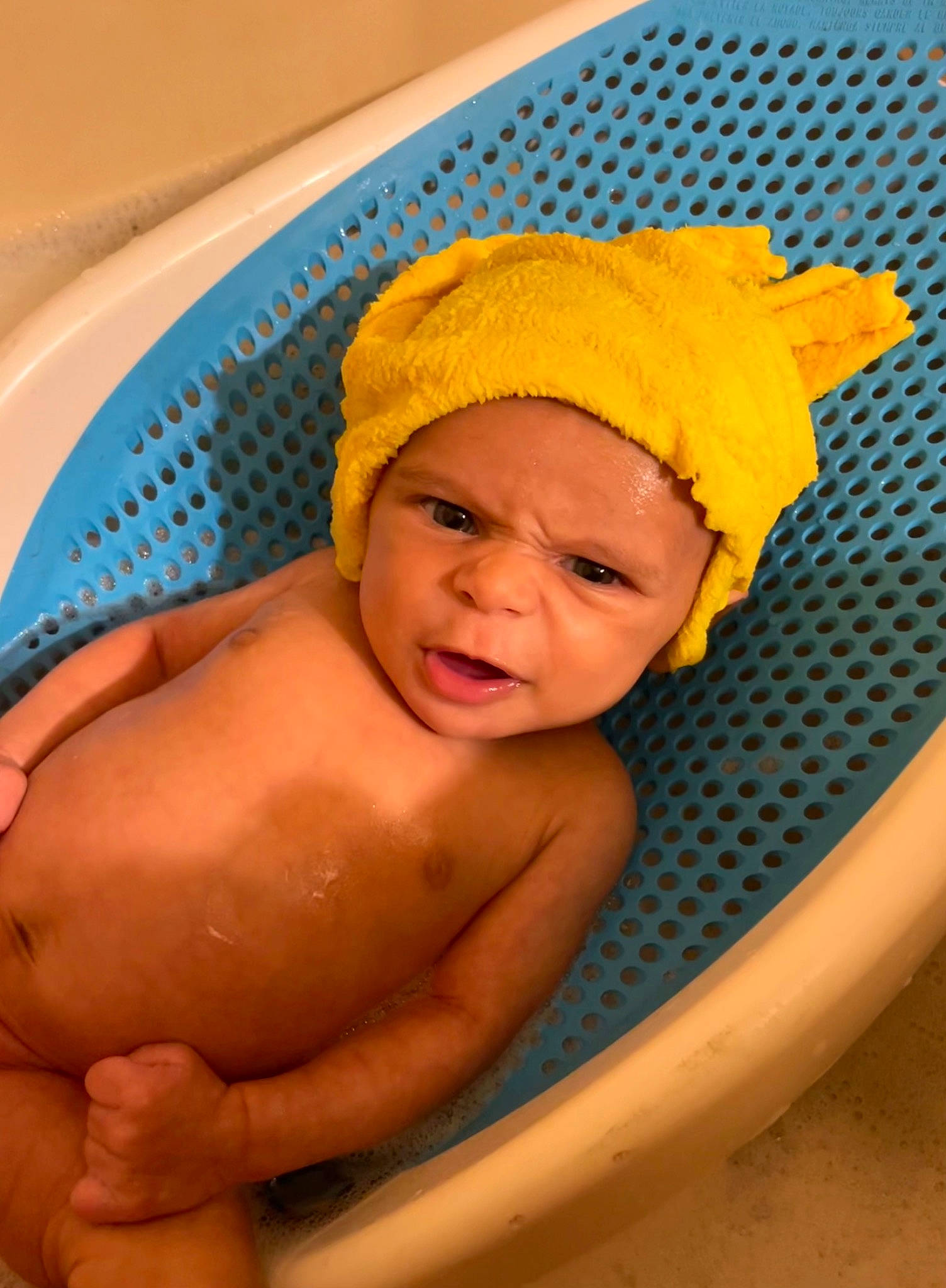 Memphis is registered to the contest to win money with this photo: baby, baby_bathing, baby_products, bathing, bathtub, beanie, cap, chest, child, circle, comfort, fun, headwear, knit_cap, leisure, person, play, product, thumb, toddler