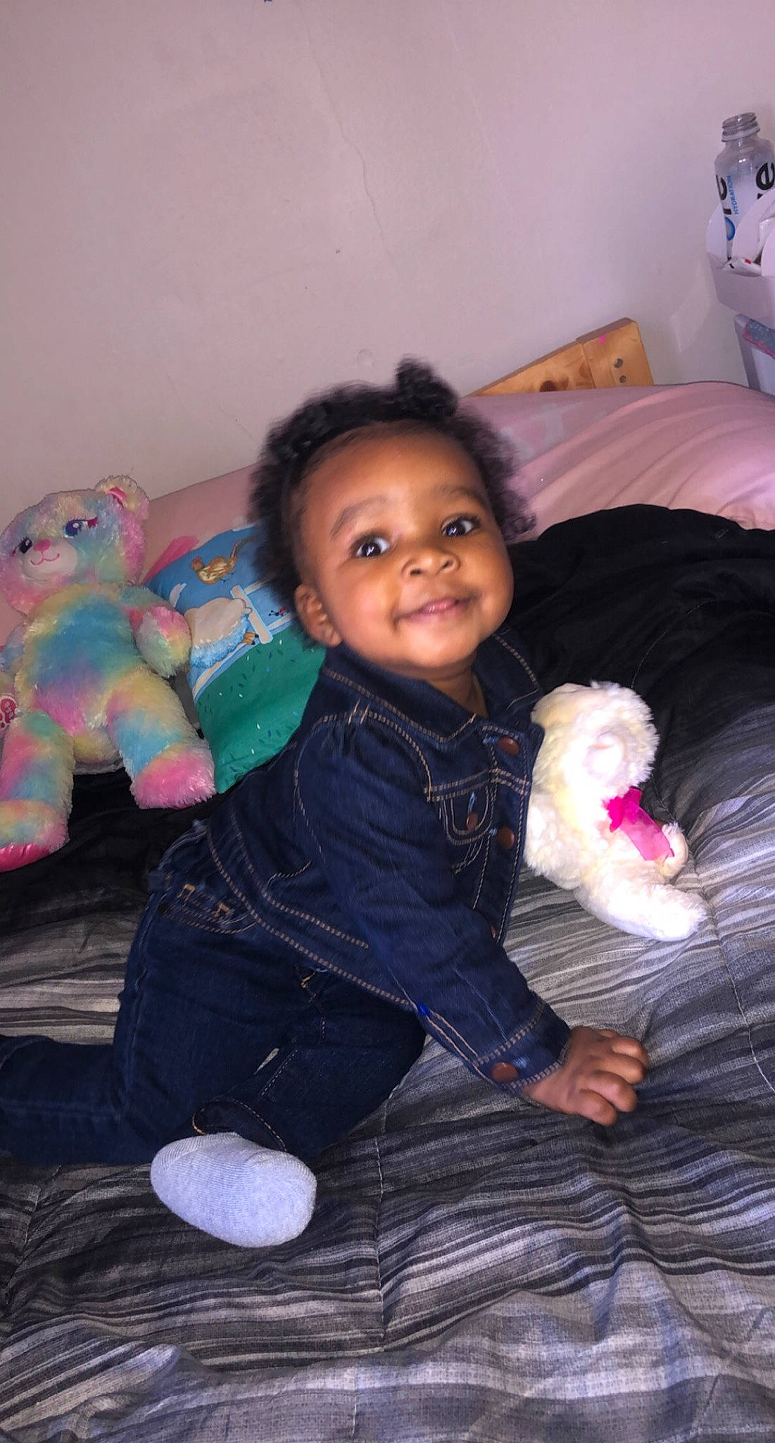 Araya is registered to the contest to win money with this photo: baby, baby_products, baby_toddler_clothing, baby_toys, bed, bed_sheet, bedding, bedroom, fur, joy, linens, overall, person, pink, plush, stuffed_toy, textile, toy