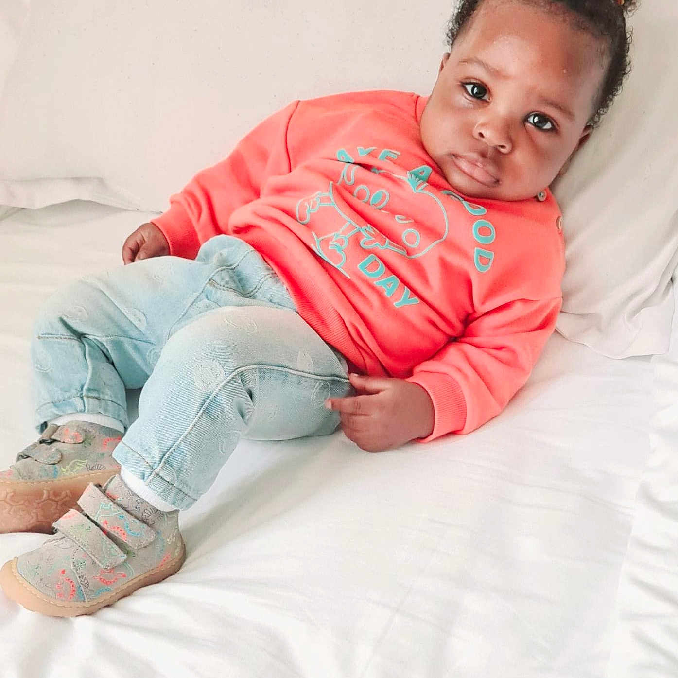 Oluwajomiloju is registered to the contest to win money with this photo: baby, bed, casual, child, clothing, cozy, cute, denim, expression, face, hair, indoor, infant, lying_down, pants, portrait, shoes, skin, sweatshirt, white_bed