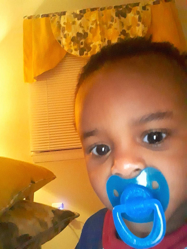 Myles is registered to the contest to win money with this photo: baby, cheek, child, ear, electric_blue, eye, eyebrow, eyelash, forehead, fun, hair, happy, head, iris, light, lip, mouth, nose, orange, person