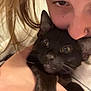 Toothless joined the competition — help win amazing prizes! person, cat, black_cat, face, hand, close_up, nose_piercing, whiskers, fur, hair, animal, pet, cuddle, indoor, expression, portrait, love, affection, holding, warmth