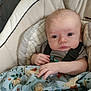 Casey is registered to the contest to win money with this photo: animal_print, baby, baby_seat, blanket, child, clothing, comfort, cushion, cute, expression, eyes, face, hand, head, indoor, infant, pattern, person, portrait, young