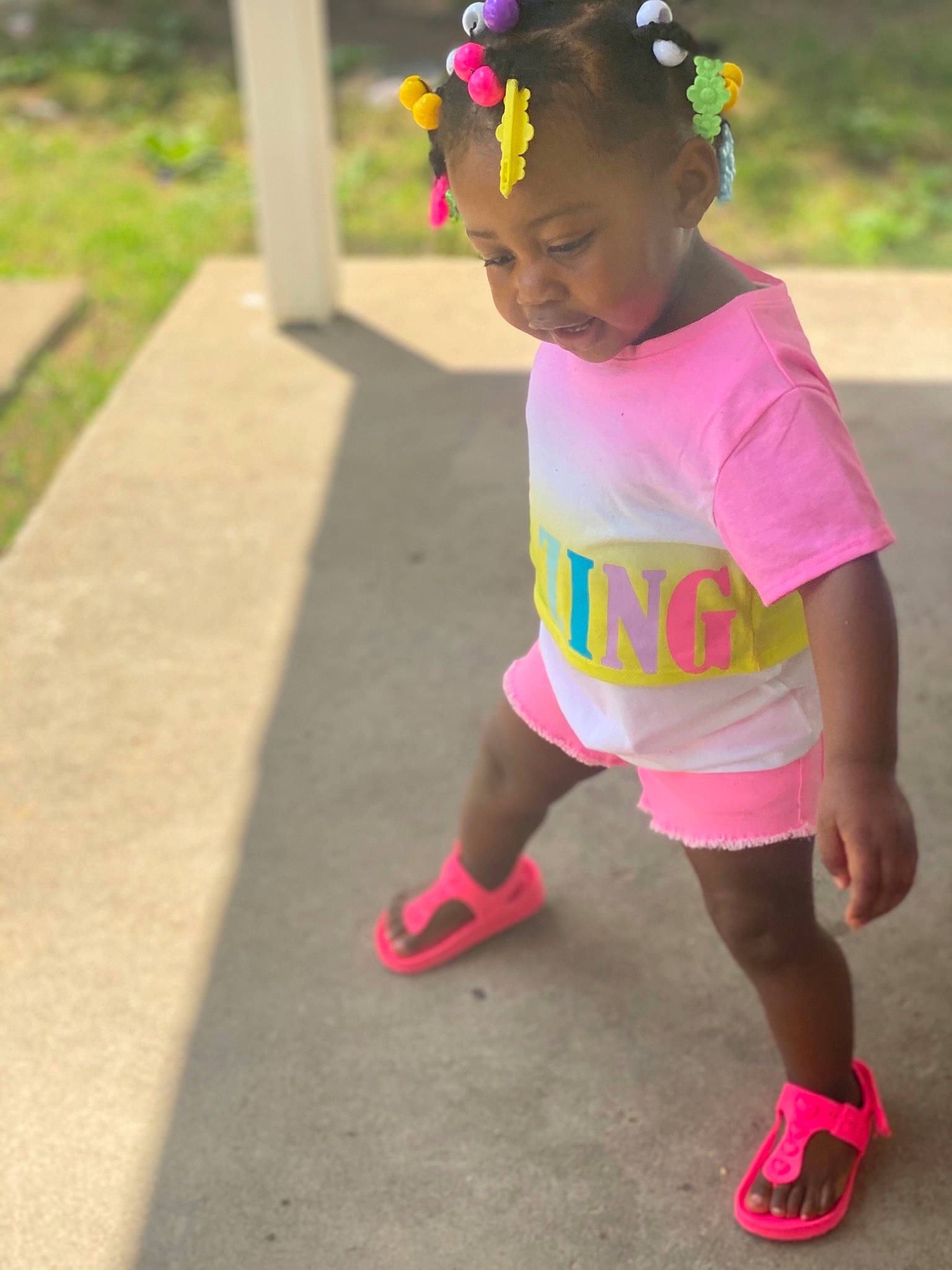 Serenity joined the competition — help win amazing prizes! asphalt, baby_toddler_clothing, child, face, facial_expression, fun, grass, happy, human_leg, leisure, magenta, person, pink, plant, recreation, sandal, shorts, sleeve, smile, t_shirt