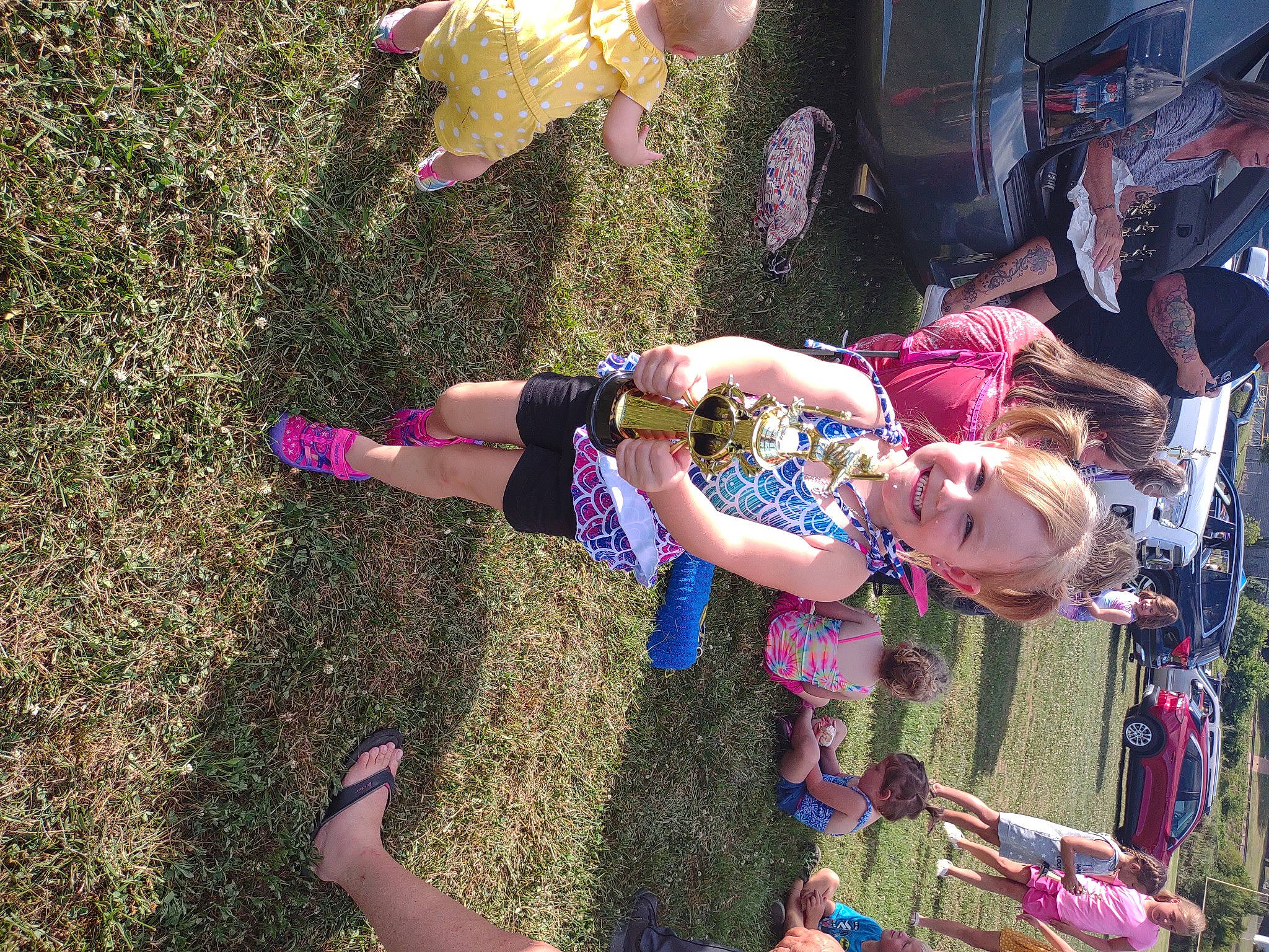 Kenzleigh joined the competition — help win amazing prizes! child, event, fun, grass, happy, hat, joy, leisure, magenta, people_in_nature, person, pink, plant, public_event, recreation, smile, spring, summer, toddler, tree