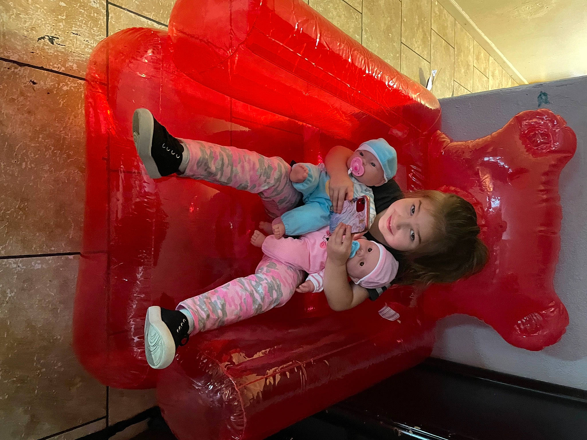 Amalia is registered to the contest to win money with this photo: baby, baby_toddler_clothing, carmine, child, chute, comfort, fun, headwear, human_leg, inflatable, joy, leisure, magenta, outdoor_play_equipment, person, pink, plastic, play, playground, recreation