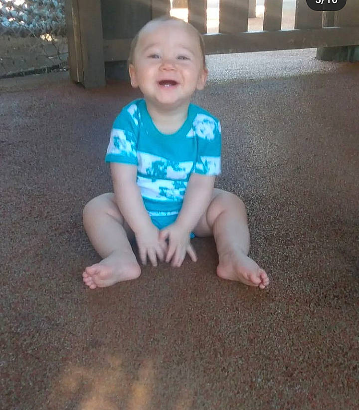 Cyrus is registered to the contest to win money with this photo: asphalt, baby, baby_toddler_clothing, cheek, chin, eye, floor, flooring, fun, grass, happy, head, iris, mouth, person, road_surface, skin, sleeve, smile, t_shirt