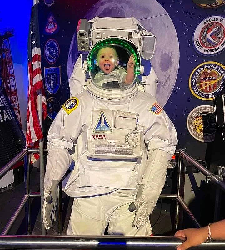 Cyrus joined the competition — help win amazing prizes! aerospace_engineering, astronaut, astronomer, astronomical_object, circle, engineering, event, fashion_design, gesture, headwear, helmet, job, machine, person, personal_protective_equipment, science, service, space, space_shuttle, spacecraft