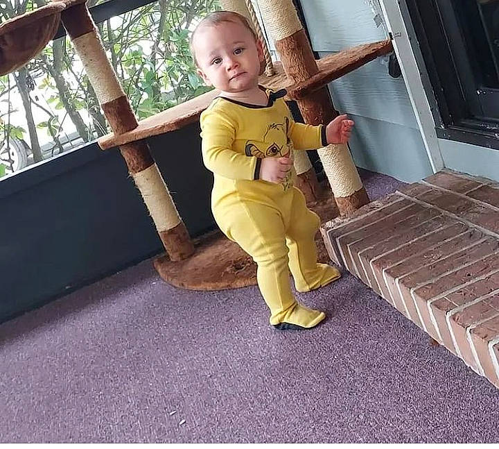 Cyrus joined the competition — help win amazing prizes! baby, boot, chair, comfort, flooring, fun, grass, happy, human_leg, knee, leisure, metal, person, recreation, sandal, sitting, smile, sneakers, thigh, toddler