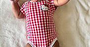 Kamila joined the competition — help win amazing prizes! baby, infant, smiling, lying_down, onesie, red_and_white, checkered_pattern, hello_kitty, socks, soft_blanket, happy, cute, child, indoors, skin, person, portrait, small_ears, raised_arms, cheerful