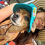 bench, canine, casual, closeup, colorful, dog, friendly, hat, leash, outdoor, people, person, pet, relaxed, roof, seating, selfie, shade, smile, sunhat
