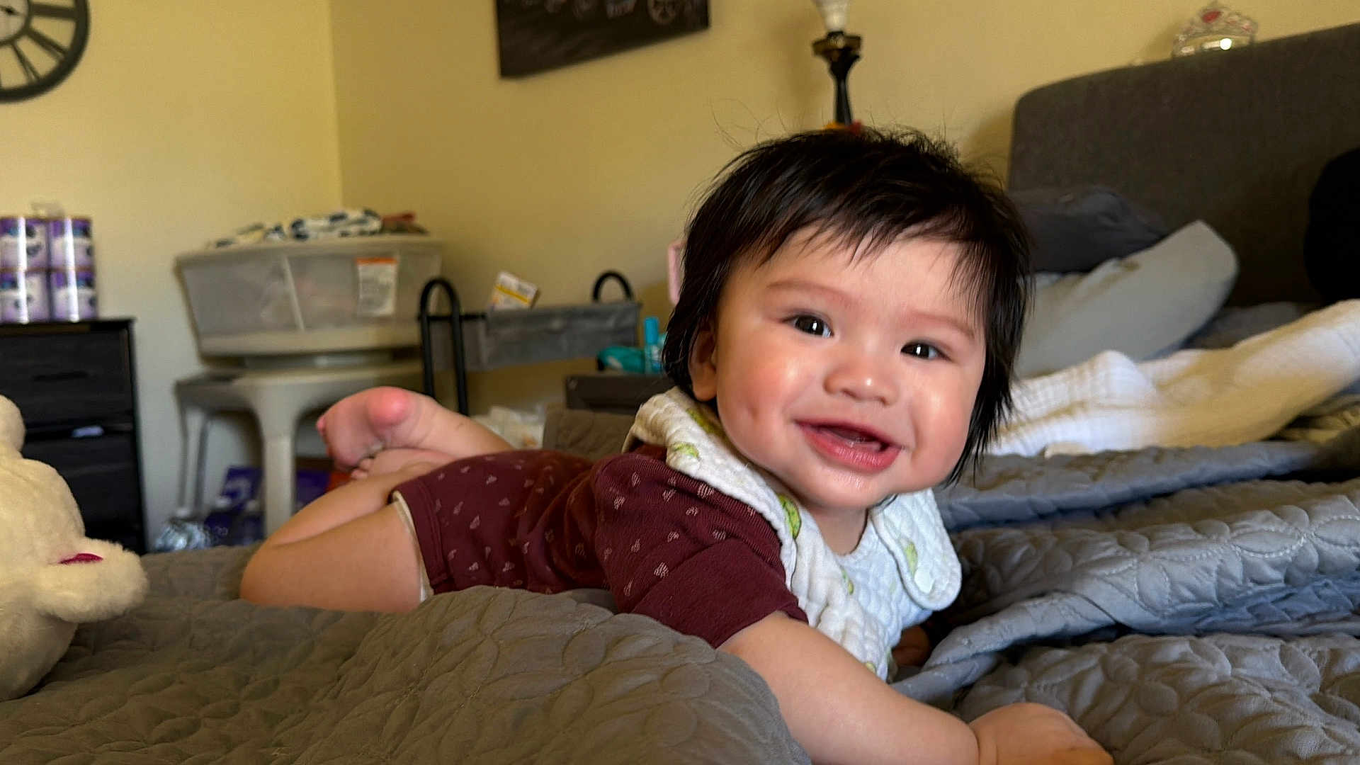 Xzavien Jheorge is registered to the contest to win money with this photo: baby, infant, child, smile, face, dimple, hair, bib, blanket, bed, pillow, quilt, toy, plush, furniture, nightstand, lamp, diaper, cute, indoor