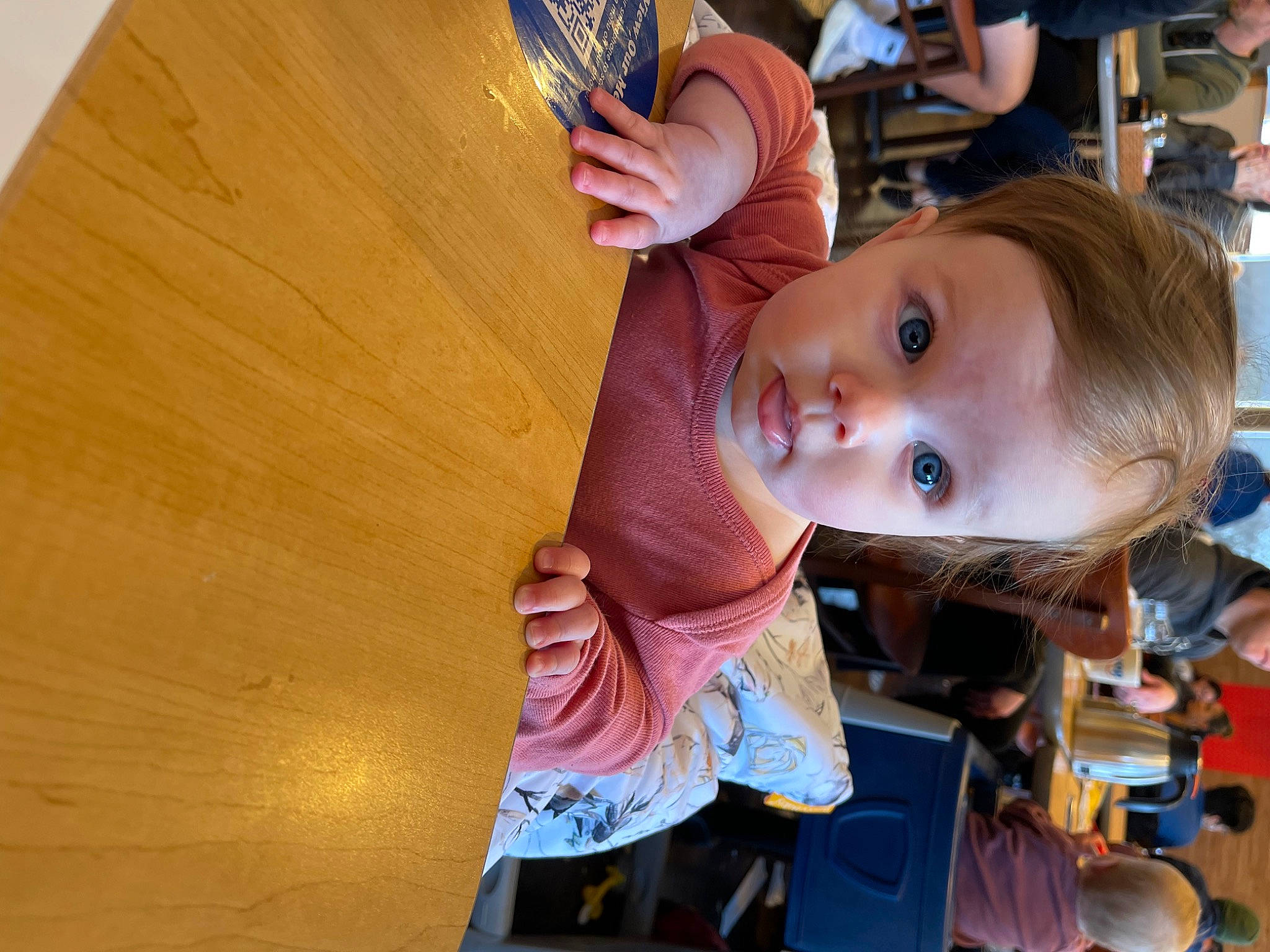 Kailani is registered to the contest to win money with this photo: baby, blurred, chair, child, food, fun, happy, hardwood, hat, kindergarten, leisure, person, play, recreation, room, sitting, tableware, toddler, tree, water