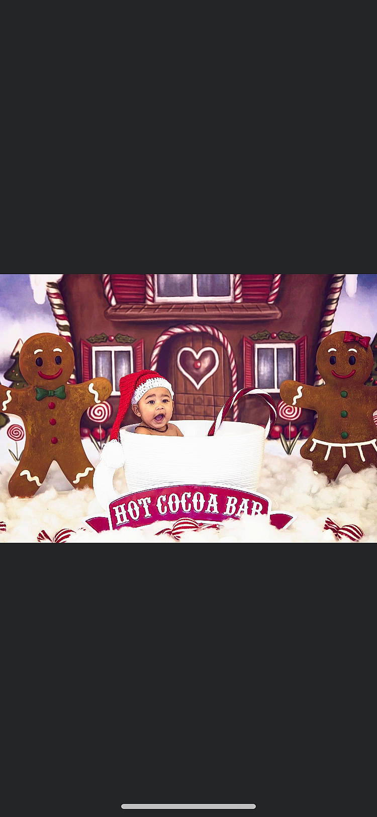 Javon is registered to the contest to win money with this photo: animation, cartoon, christmas, christmas_decoration, christmas_eve, dessert, font, food, gingerbread, gingerbread_house, headwear, interior_design, person, surprise, teddy_bear, toy