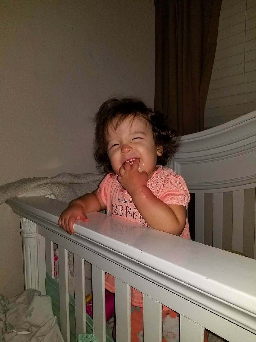 Ireland is registered to the contest to win money with this photo: arm, bed, bedtime, child, eye, fun, furniture, girl, infant, infant_bed, leg, organ, person, product, sitting, skin, toddler