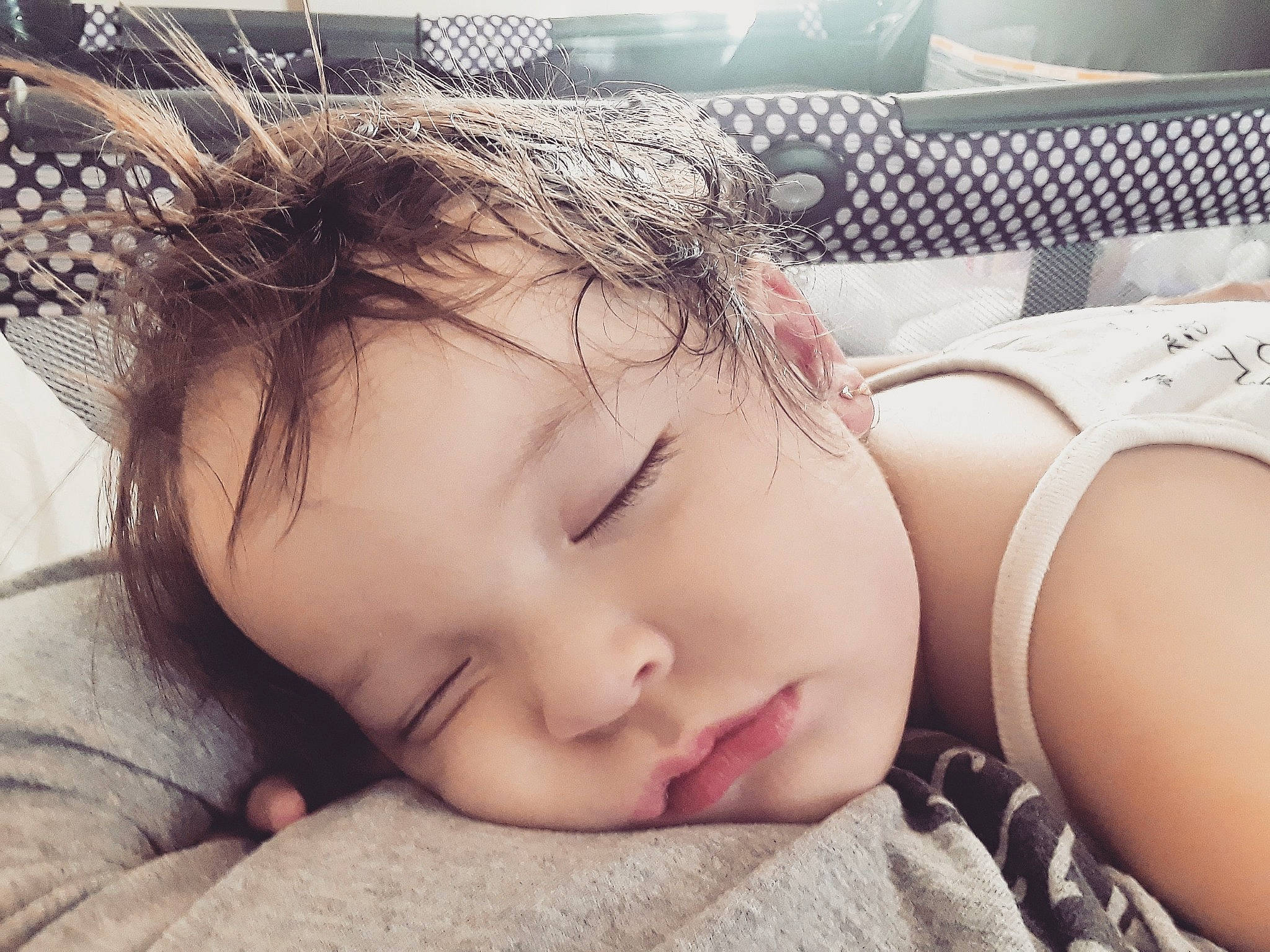 Ireland is registered to the contest to win money with this photo: bedtime, brown_hair, cheek, child, ear, girl, infant, lip, person, sleep