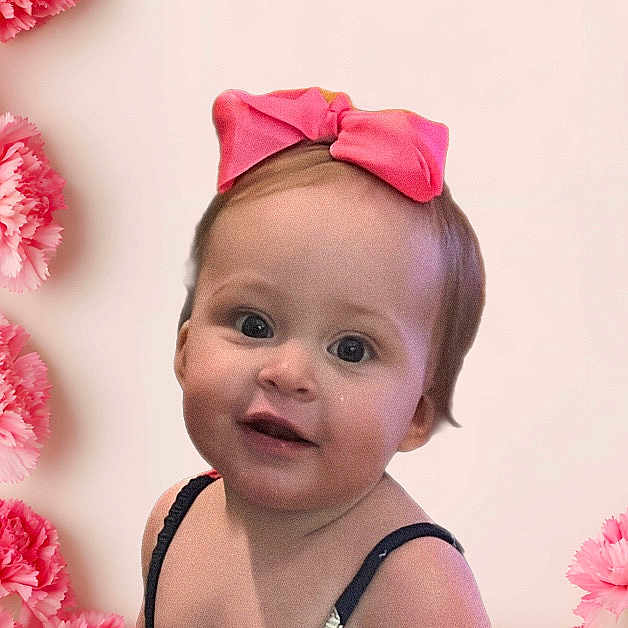 Lorraine joined the competition — help win amazing prizes! toddler, child, pink_bow, flowers, carnations, portrait, smiling, cute, baby, head, face, flower_arrangement, pink, background, closeup, young_child, innocent, happy, studio, feminine