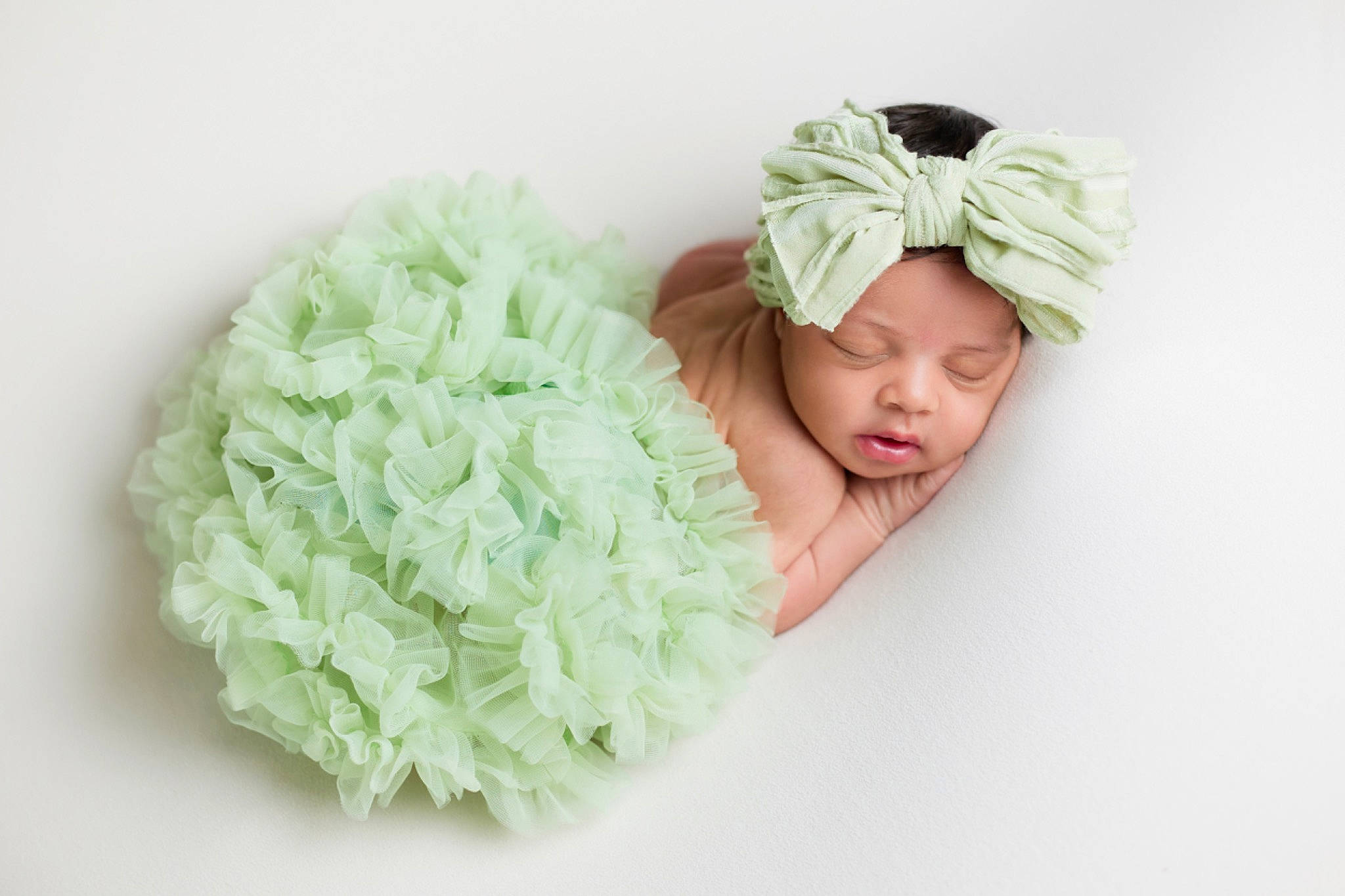 Rachel is registered to the contest to win money with this photo: baby, baby_sleeping, bridal_accessory, cap, comfort, cut_flowers, fashion_accessory, finger, grass, hair_accessory, hand, happy, headband, headgear, headpiece, headwear, knit_cap, linens, person, petal