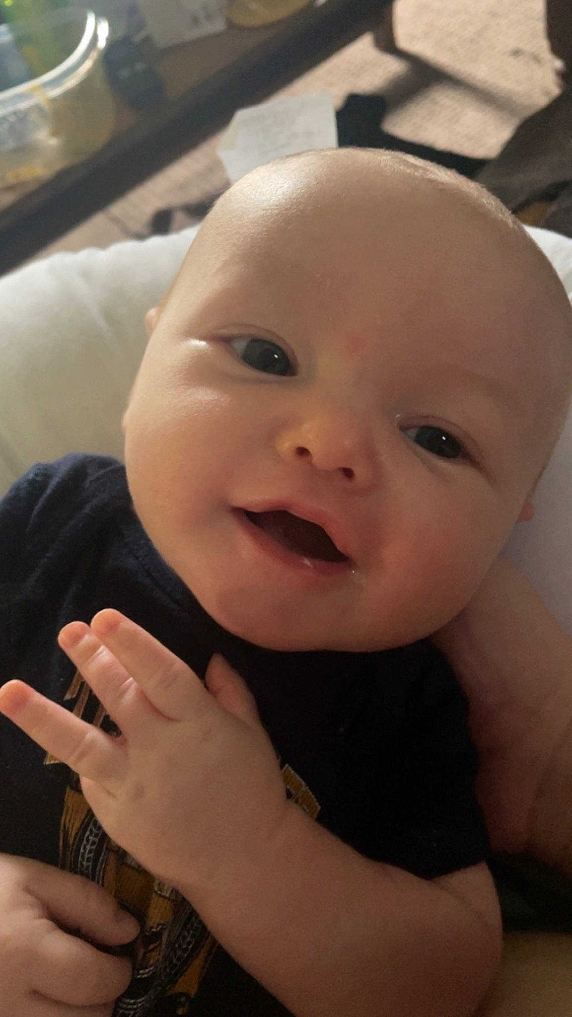 Myles is registered to the contest to win money with this photo: baby, cheek, ear, eye, eyebrow, eyelash, finger, gesture, hand, happy, human_body, iris, lip, mouth, nose, person, skin, sleeve, smile, thumb