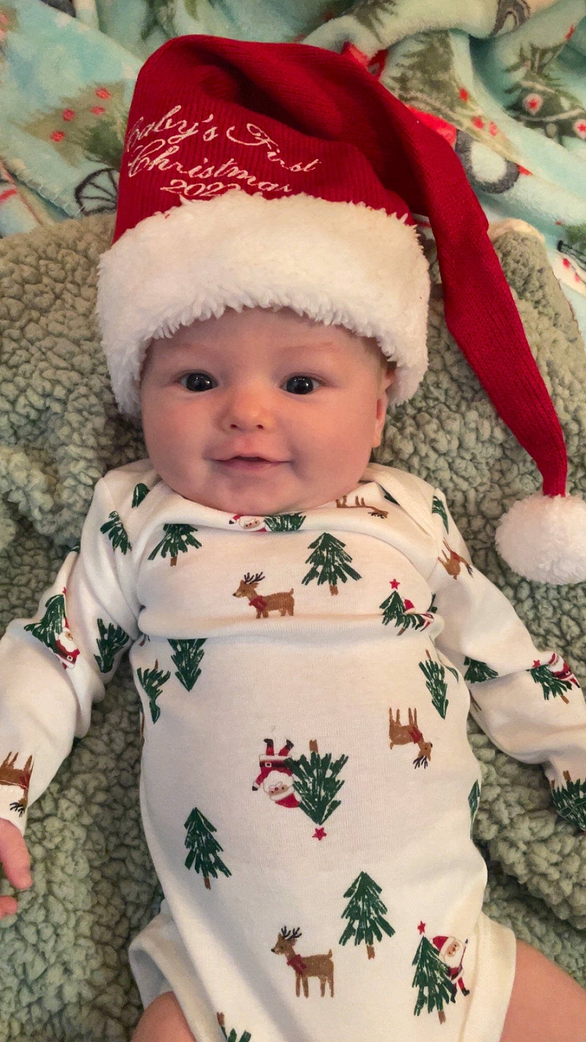 Myles joined the competition — help win amazing prizes! baby, baby_toddler_clothing, cap, cheek, child, eye, face, green, head, headgear, headwear, human_body, lip, outerwear, person, red, skin, sleeve, smile, textile