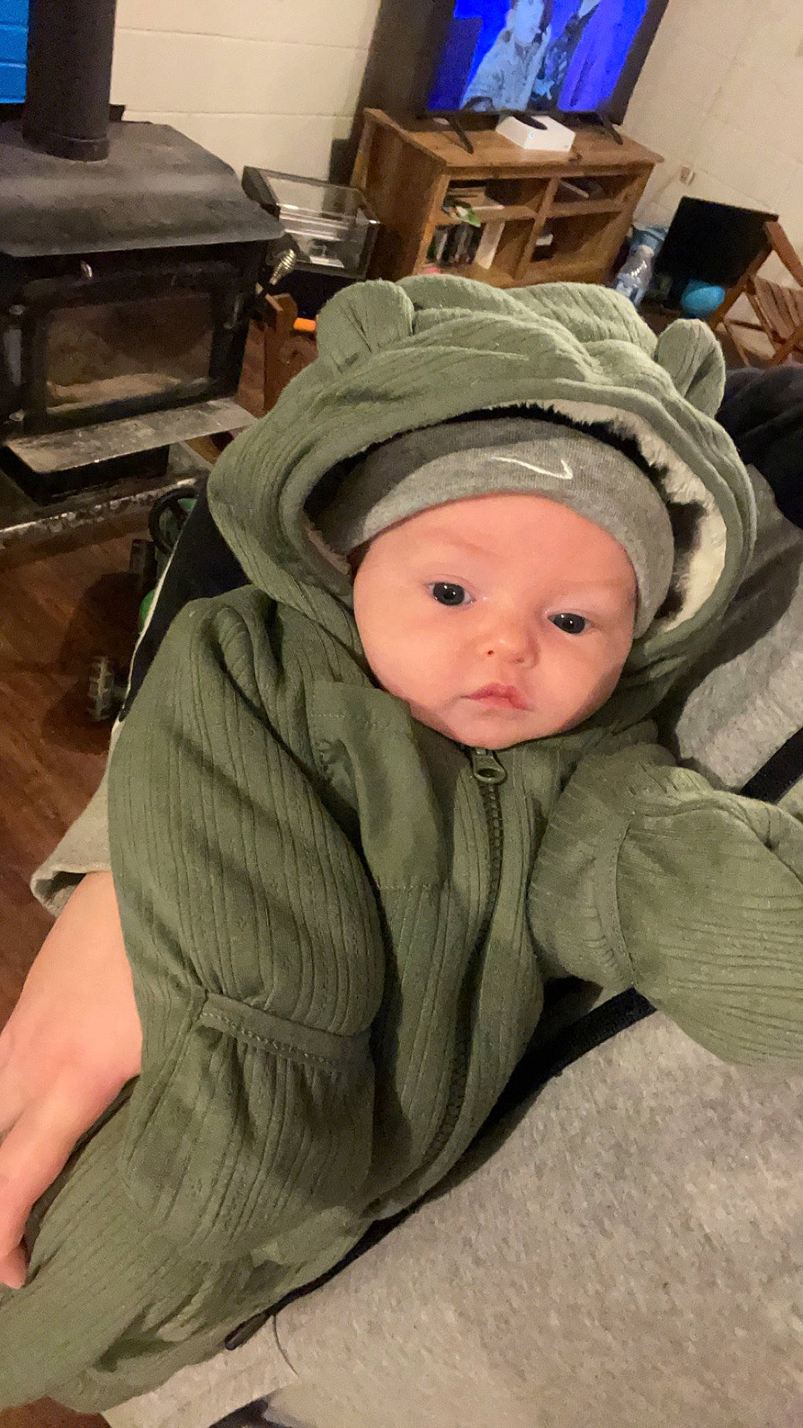 Myles is registered to the contest to win money with this photo: baby, baby_products, baby_safety, baby_toddler_clothing, beanie, cap, cheek, child, comfort, eye, flooring, fun, fur, headwear, helmet, hoodie, jacket, person, personal_protective_equipment, room
