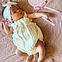 Angela is registered to the contest to win money with this photo: baby, infant, white_clothing, headband, blanket, heart_shaped_sign, milestone, one_month, lying_down, cute, adorable, soft_texture, star_pattern, pink_ribbon, skin, newborn, child, portrait, celebration, peaceful