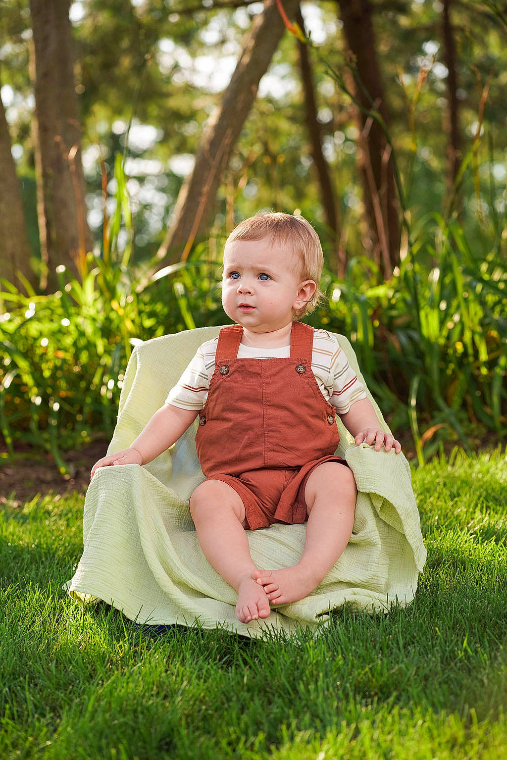Mason is registered to the contest to win money with this photo: baby, baby_toddler_clothing, child, flash_photography, forest, fun, garden, grass, grassland, happy, leaf, leisure, people_in_nature, person, plant, portrait_photography, recreation, sitting, toddler, tree