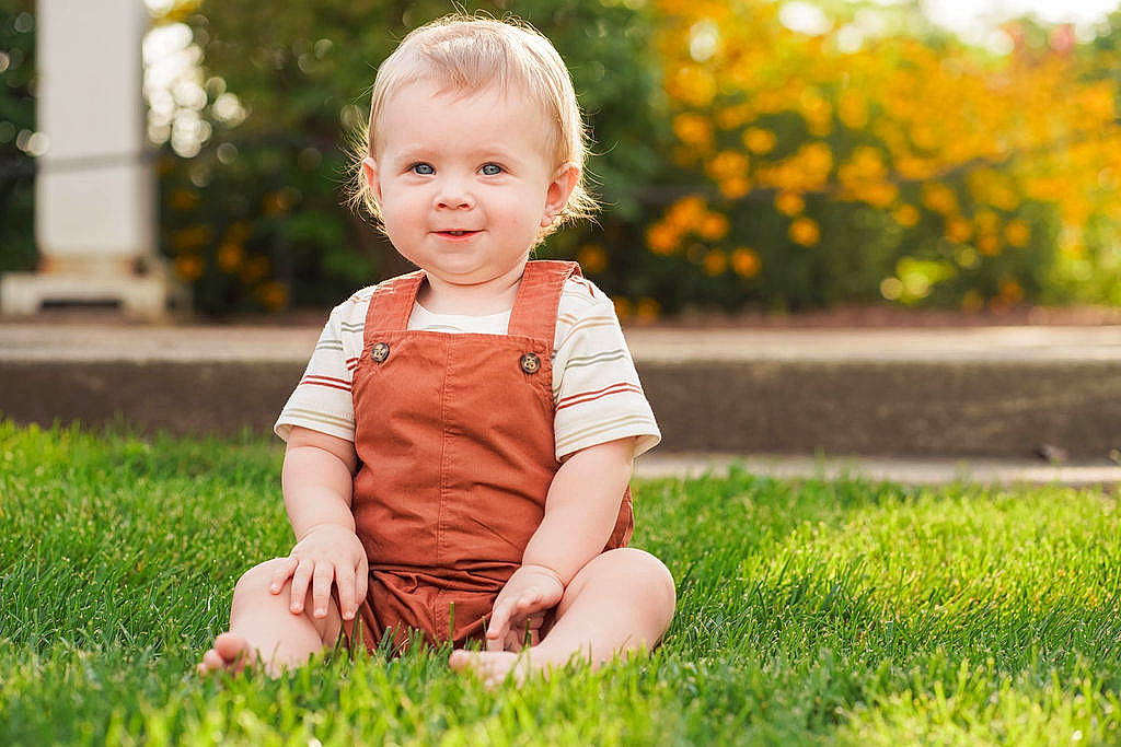 Mason is registered to the contest to win money with this photo: baby, baby_toddler_clothing, blond, child, flash_photography, fun, grass, happy, joy, lawn, leisure, people_in_nature, person, plant, sitting, skin, smile, t_shirt, toddler, tree