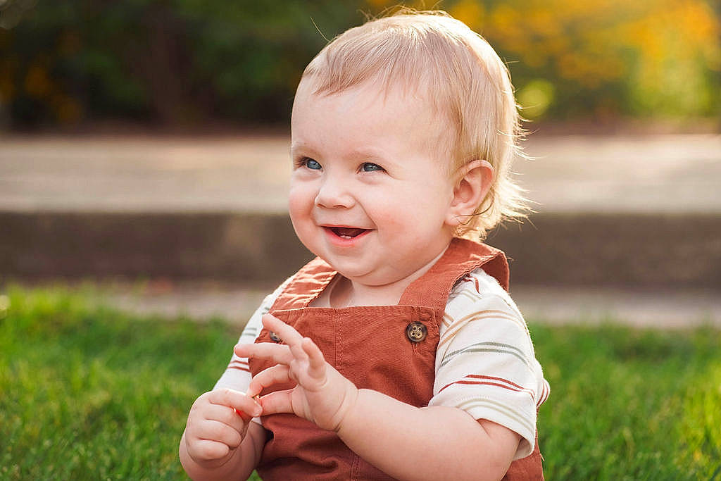 Mason is registered to the contest to win money with this photo: arm, baby, baby_toddler_clothing, cheek, child, dress, eye, face, flash_photography, fun, gesture, grass, hand, happy, joy, nose, people_in_nature, person, plant, skin
