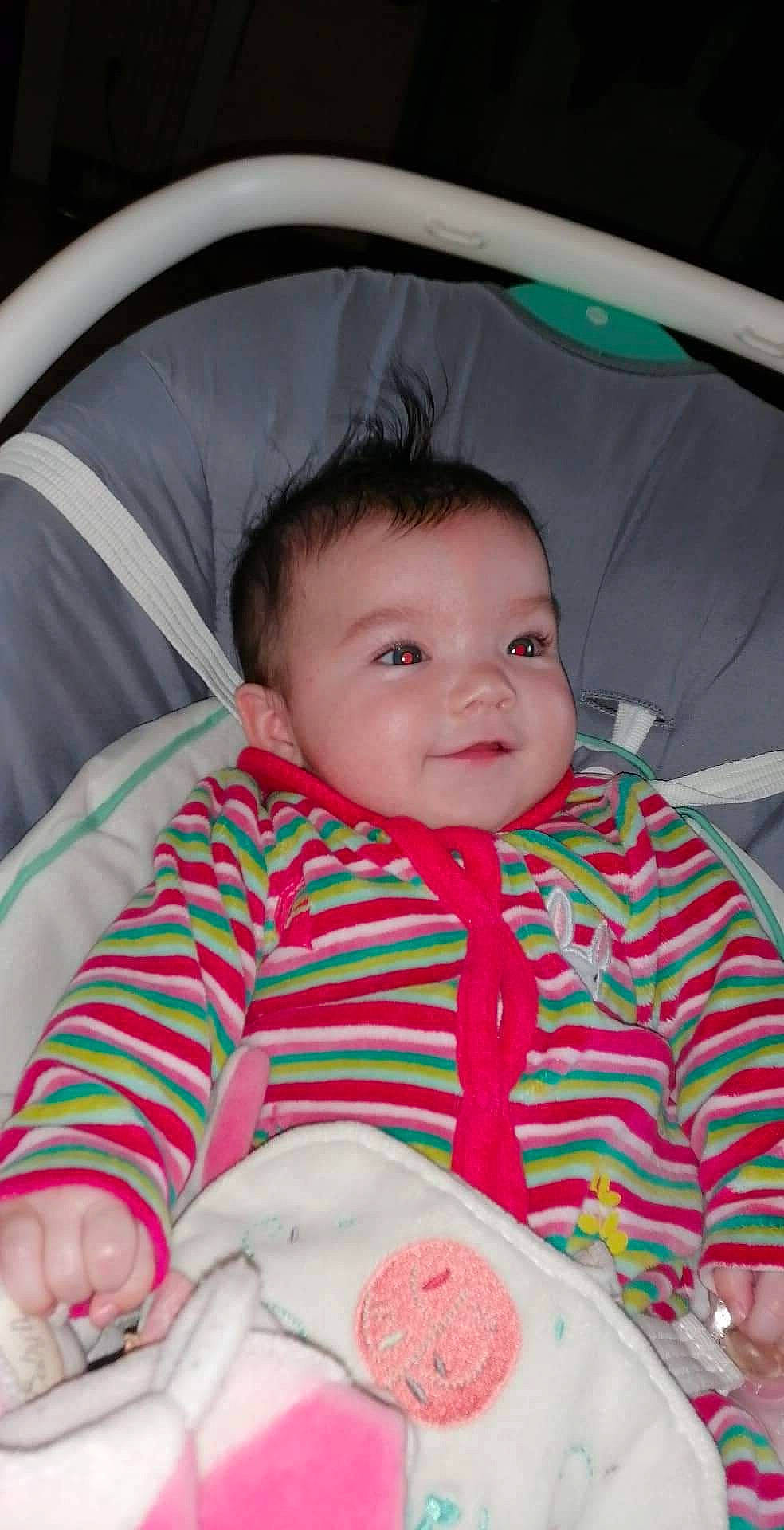 Laëna participe au concours pour gagner de l'argent avec cette photo : baby, baby_toddler_clothing, cheek, chin, comfort, eyebrow, face, happy, iris, lip, mouth, nose, organ, outerwear, person, pink, skin, sleeve, smile, textile