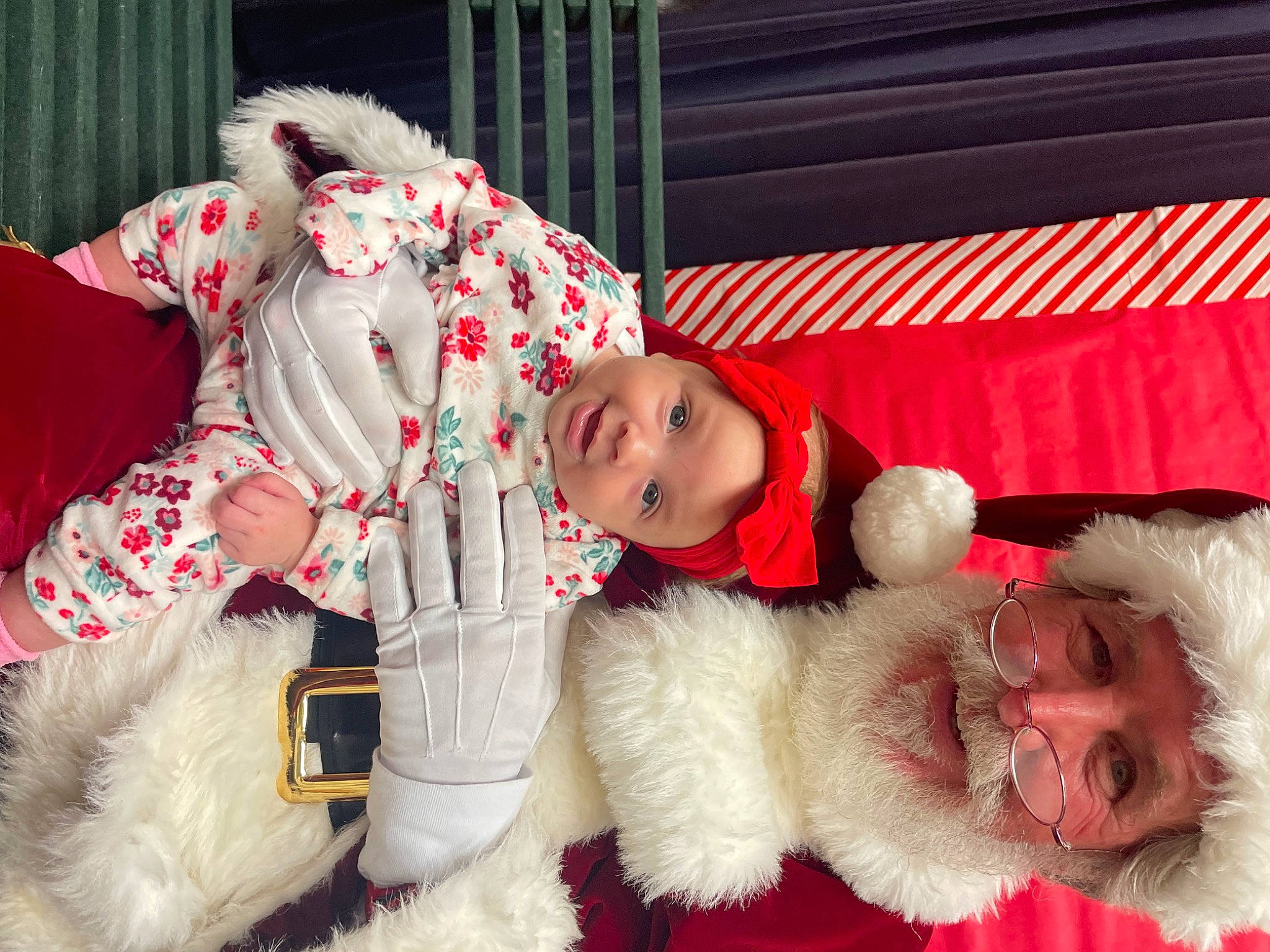 Justyce joined the competition — help win amazing prizes! carmine, child, christmas, christmas_eve, companion_dog, costume, event, fictional_character, fur, fur_clothing, hat, headwear, holiday, lap, person, pink, red, santa_claus, sporting_group, textile