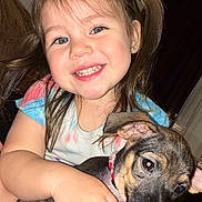Dulce Sofia is registered to the contest to win money with this photo: animal, casual, child, companionship, cute, dog, face, girl, happy, holding, indoor, love, person, pet, playing, portrait, puppy, smiling, toddler, young