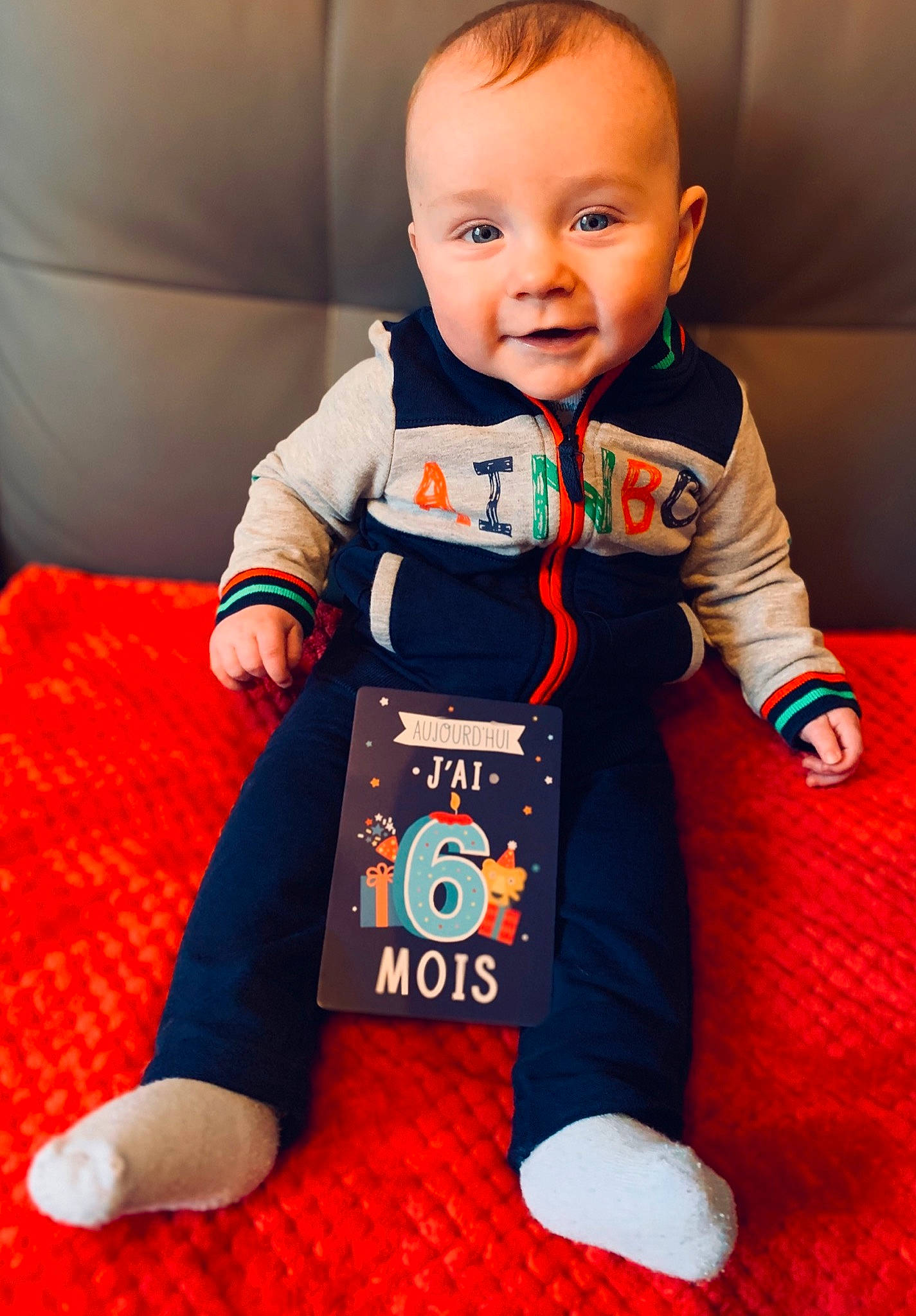 Louis participe au concours pour gagner de l'argent avec cette photo : baby, baby_products, baby_toddler_clothing, child, hoodie, overall, person, product, sleeve, t_shirt, toddler, toy