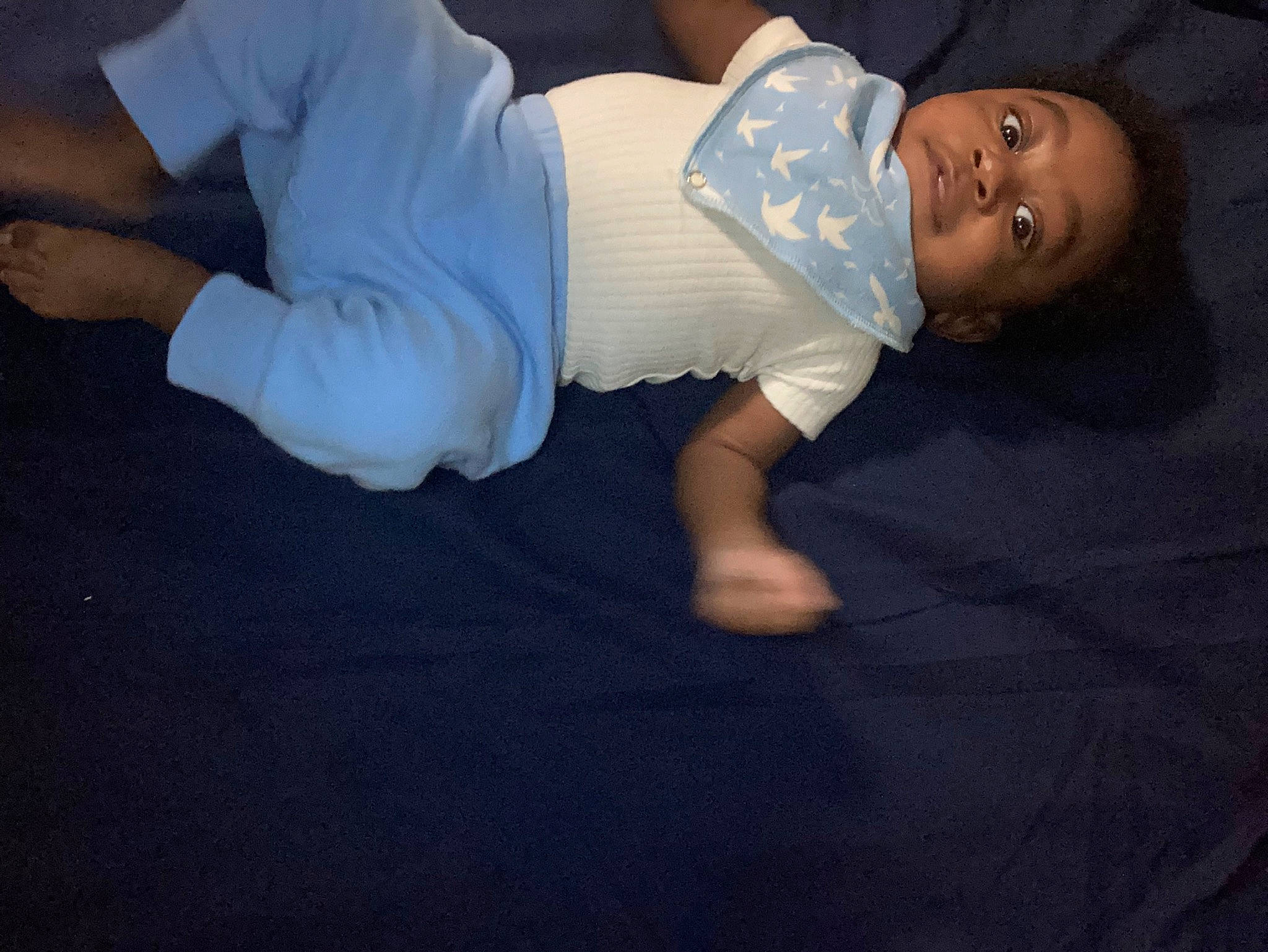Jaydan is registered to the contest to win money with this photo: abdomen, baby, baby_toddler_clothing, barefoot, child, comfort, darkness, elbow, flash_photography, flooring, fun, gesture, hat, head, human_leg, knee, person, sitting, sleeve, t_shirt
