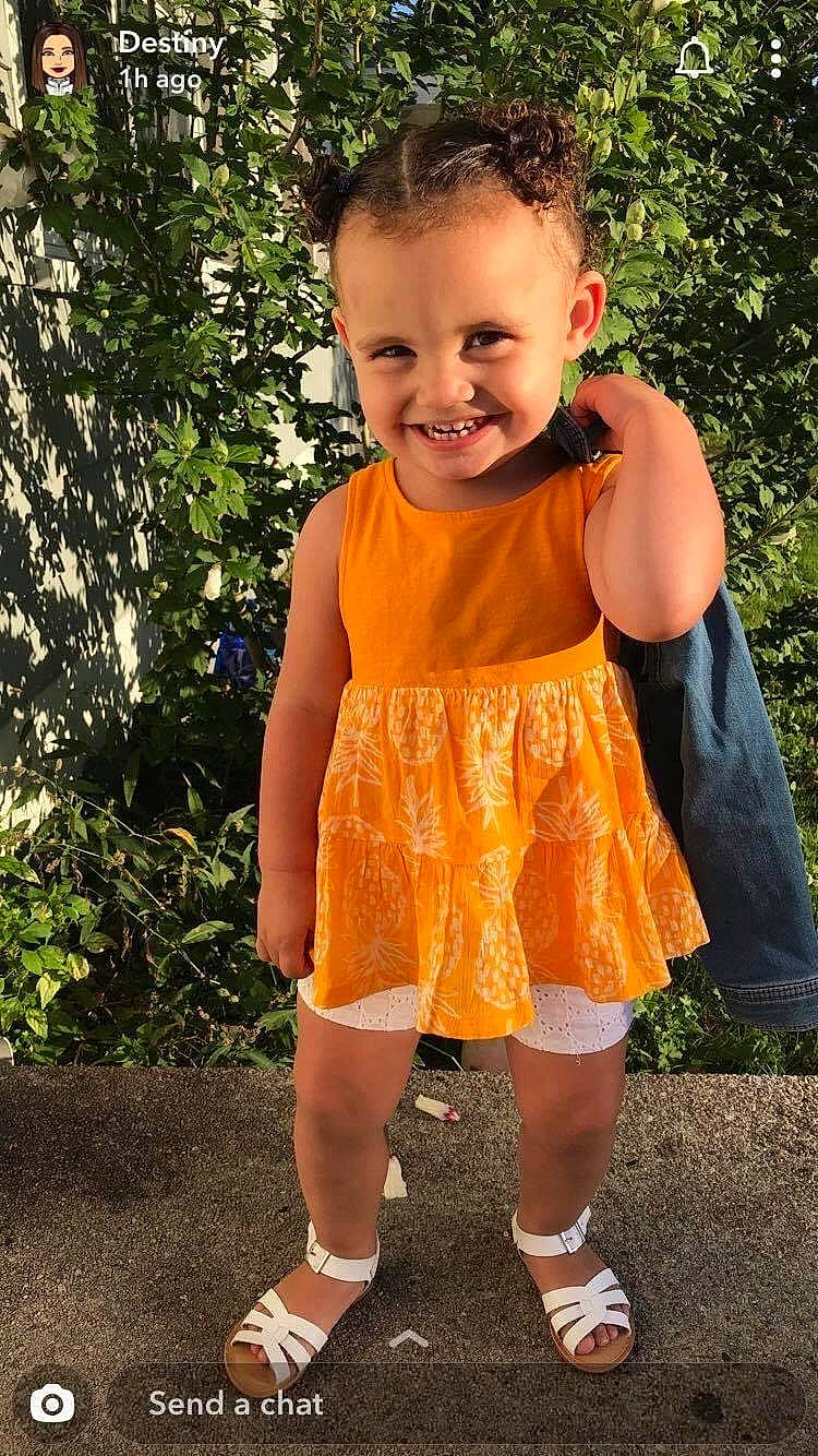 Elaina is registered to the contest to win money with this photo: baby_toddler_clothing, blond, child, denim, electric_blue, fun, grass, happy, human_leg, joy, leisure, pattern, peach, people_in_nature, person, pumpkin, shorts, shoulder, sleeve, smile