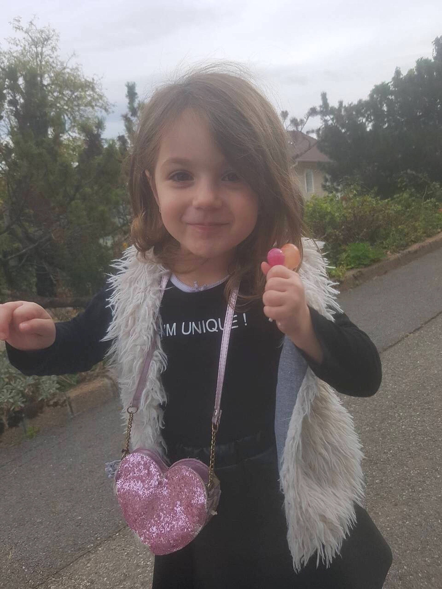 Enesa participe au concours pour gagner de l'argent avec cette photo : arm, child, child_model, day, fun, fur, girl, joy, long_hair, neck, outerwear, person, pink, product, purple, skin, smile, textile