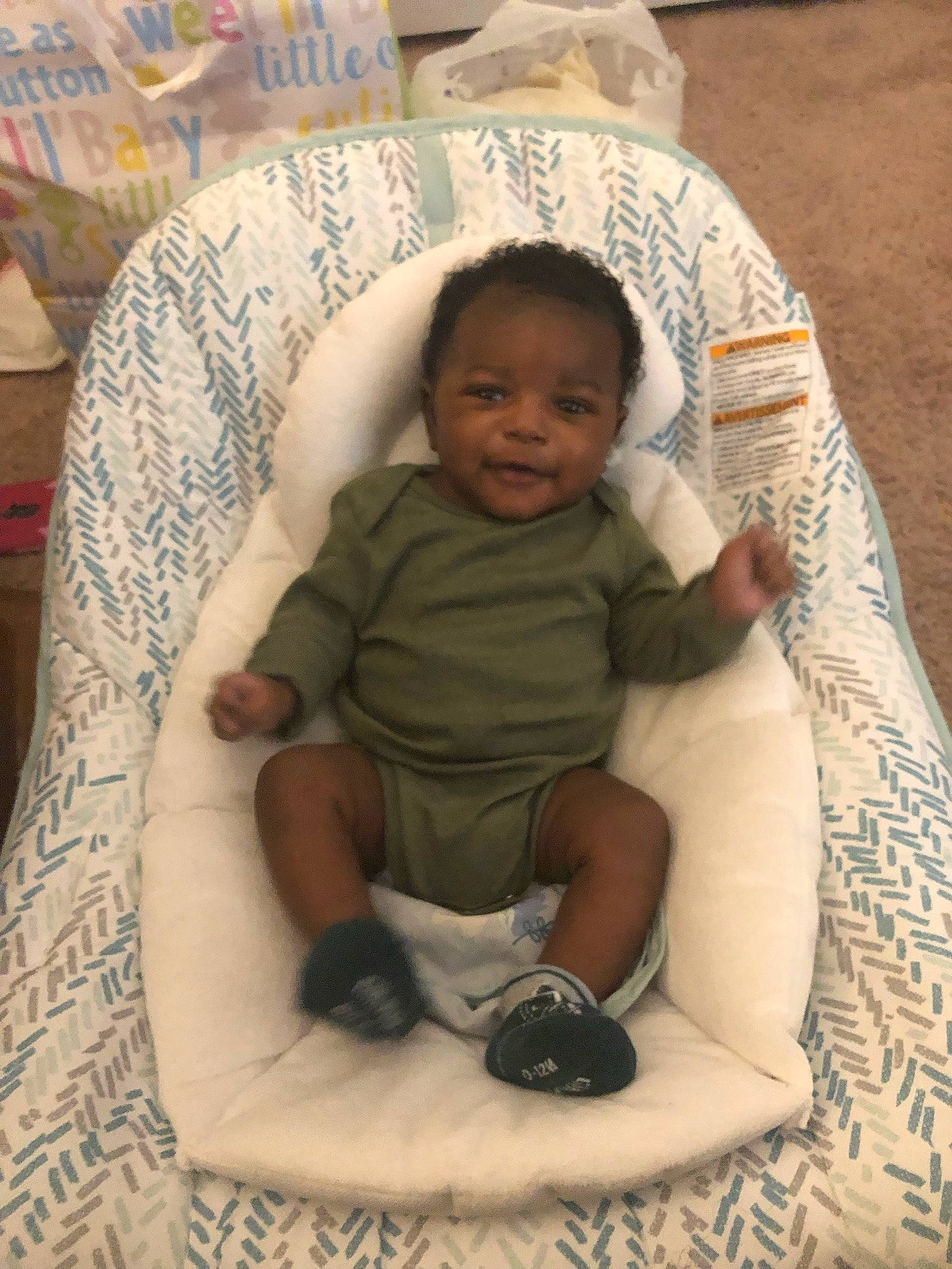 Kasian joined the competition — help win amazing prizes! baby, baby_products, baby_toddler_clothing, chair, cheek, child, comfort, flooring, fun, lap, linens, mammal, pattern, person, room, sitting, skin, sleeve, sock, textile