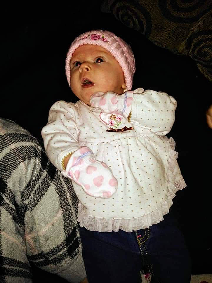 Makayla is registered to the contest to win money with this photo: baby, bonnet, cheek, child, head, headgear, headwear, knit_cap, knitting, outerwear, person, photography, pink, portrait, skin, toddler, wool