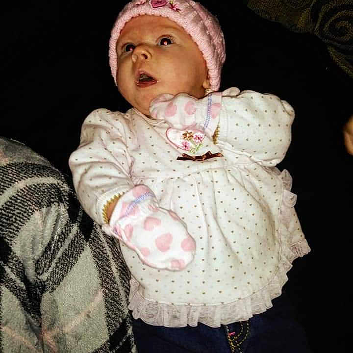 Makayla is registered to the contest to win money with this photo: baby, bonnet, cheek, child, head, headgear, headwear, knit_cap, knitting, outerwear, person, photography, pink, portrait, skin, toddler, wool