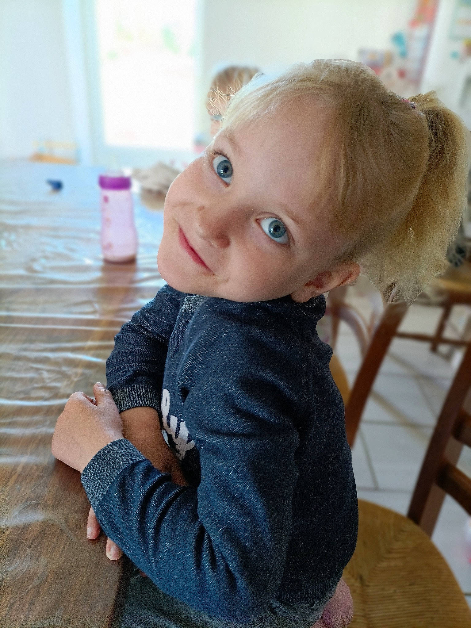 Jelena participe au concours pour gagner de l'argent avec cette photo : cheek, doll, eye, eyelash, face, floor, flooring, happy, headgear, iris, joint, joy, lip, person, skin, sleeve, smile, standing, toddler, toy